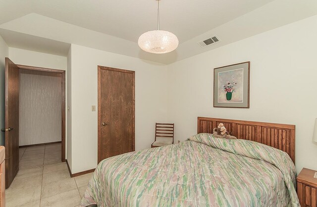 7355 N Pacific Ave, Fresno, CA 93711 - bedroom with light tile patterned flooring, visible vents, and baseboards