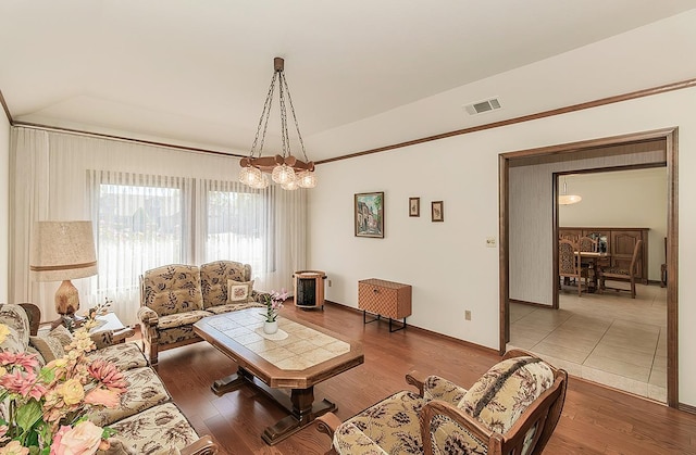 7355 N Pacific Ave, Fresno, CA 93711 - living room with wood finished floors, visible vents, and baseboards