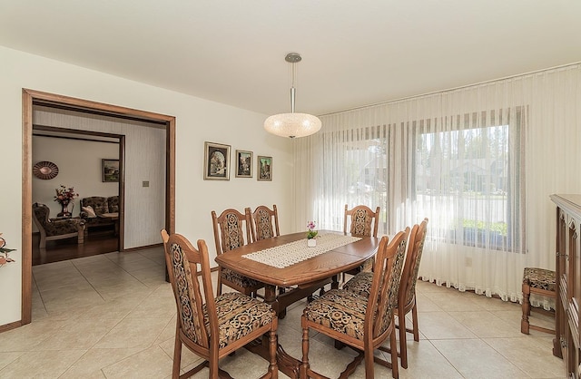 7355 N Pacific Ave, Fresno, CA 93711 - dining area with baseboards and light tile patterned flooring