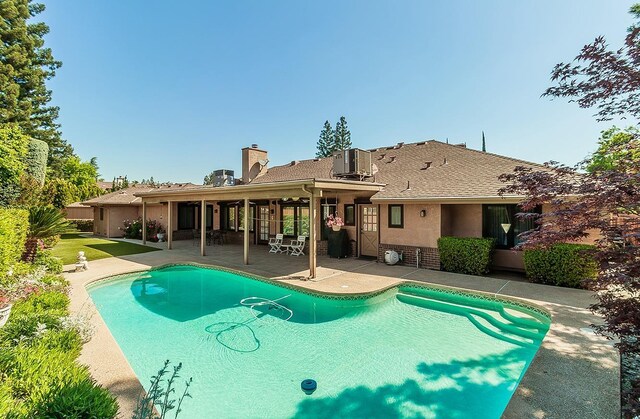 7355 N Pacific Ave, Fresno, CA 93711 - pool featuring a patio area and central AC unit