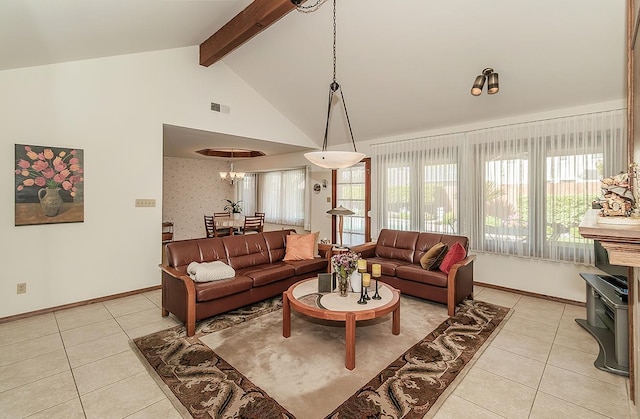 7355 N Pacific Ave, Fresno, CA 93711 - living room featuring baseboards, light tile patterned flooring, beamed ceiling, and visible vents