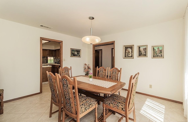 7355 N Pacific Ave, Fresno, CA 93711 - dining room featuring baseboards, visible vents, and light tile patterned floors