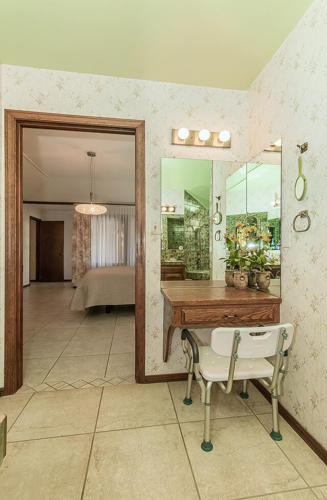 7355 N Pacific Ave, Fresno, CA 93711 - hallway with wallpapered walls, tile patterned flooring, and baseboards
