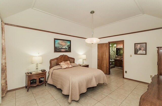 7355 N Pacific Ave, Fresno, CA 93711 - bedroom featuring vaulted ceiling, baseboards, connected bathroom, and light tile patterned floors