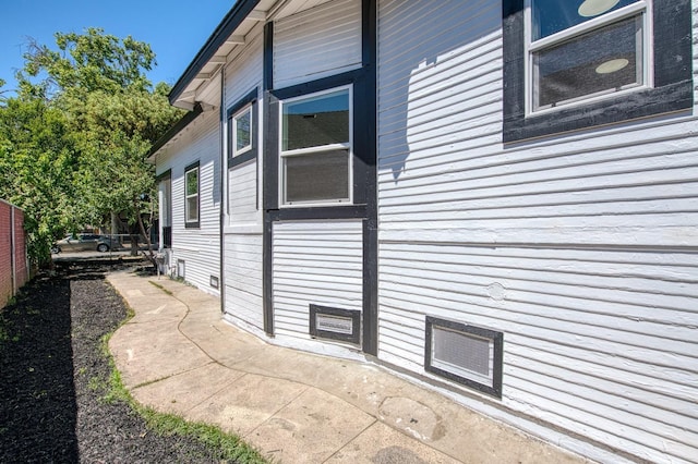 view of side of property with fence