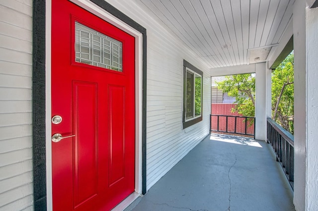 doorway to property featuring a porch