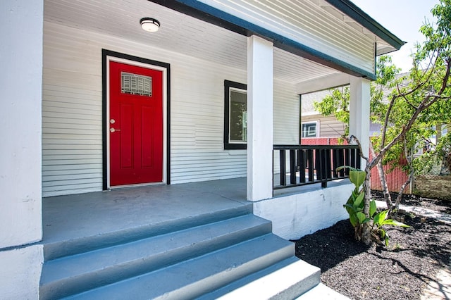 doorway to property featuring covered porch