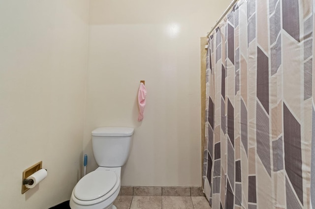 4311 N Emerson Ave, Fresno, CA 93705 - bathroom featuring toilet, baseboards, and tile patterned floors