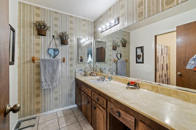 4311 N Emerson Ave, Fresno, CA 93705 - full bathroom featuring tile patterned flooring, baseboards, vanity, and wallpapered walls