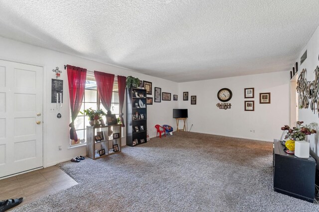 4311 N Emerson Ave, Fresno, CA 93705 - interior space featuring carpet floors and a textured ceiling