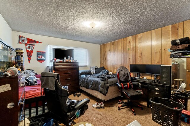 4311 N Emerson Ave, Fresno, CA 93705 - bedroom with carpet floors, a textured ceiling, and wood walls