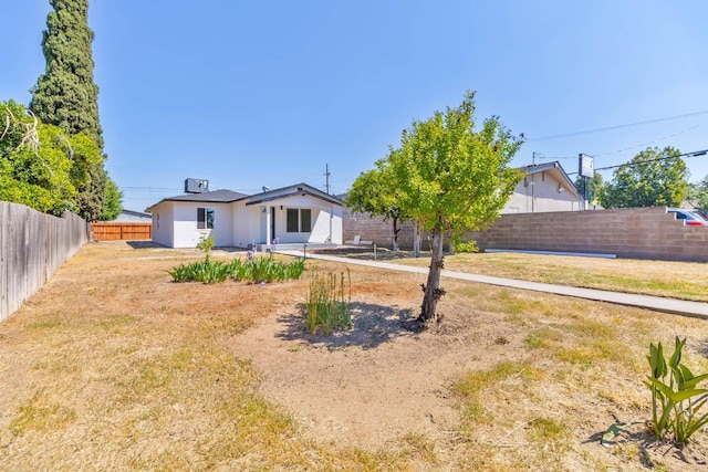 227 E Pine Ave, Fresno, CA 93728 - rear view of house featuring stucco siding