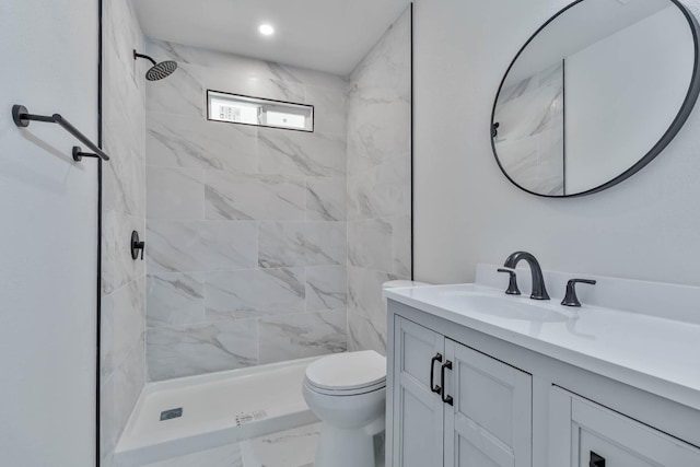227 E Pine Ave, Fresno, CA 93728 - bathroom with vanity, toilet, a shower stall, and marble look tiles