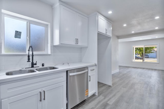 227 E Pine Ave, Fresno, CA 93728 - kitchen with a sink, stainless steel dishwasher, recessed lighting, white cabinetry, and backsplash