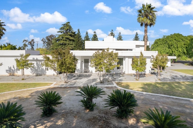 contemporary home featuring stucco siding