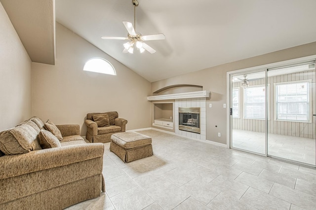 5711 W Fallon Ave, Fresno, CA 93722 - living room with built in shelves, vaulted ceiling, a ceiling fan, and light tile patterned floors