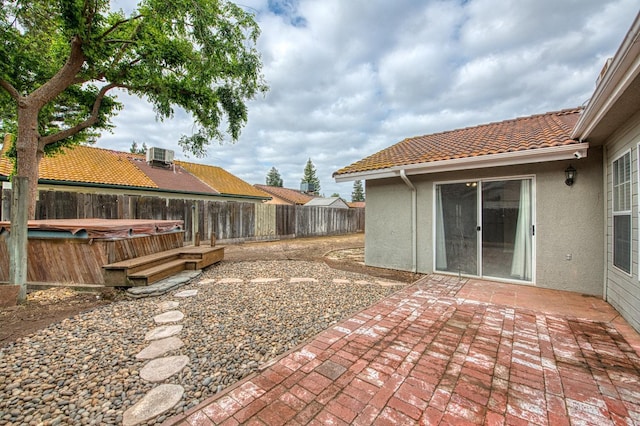 5711 W Fallon Ave, Fresno, CA 93722 - exterior space with cooling unit, a hot tub, and a fenced backyard