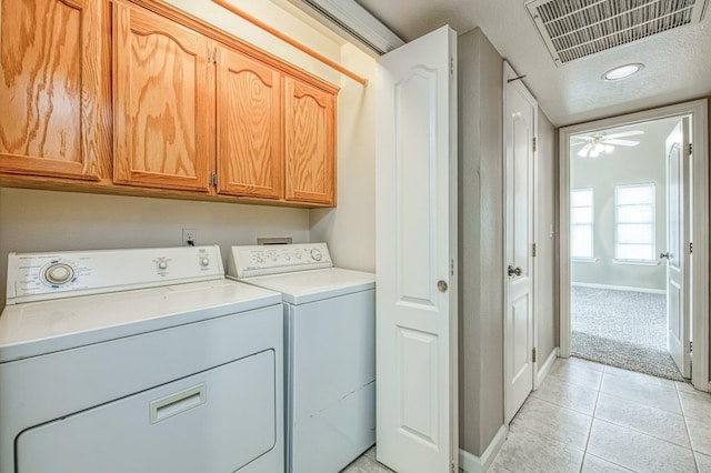 5711 W Fallon Ave, Fresno, CA 93722 - laundry area featuring light tile patterned flooring, ceiling fan, cabinet space, baseboards, and visible vents
