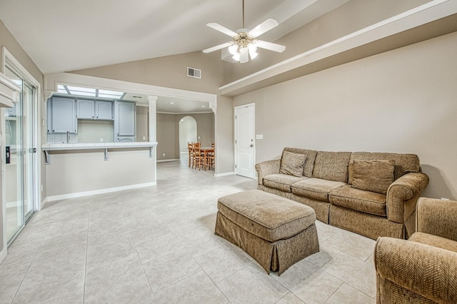 5711 W Fallon Ave, Fresno, CA 93722 - living room with light tile patterned flooring, arched walkways, visible vents, and ceiling fan
