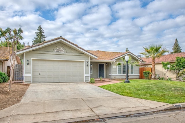 5711 W Fallon Ave, Fresno, CA 93722 - single story home featuring a front yard, a tiled roof, concrete driveway, and fence