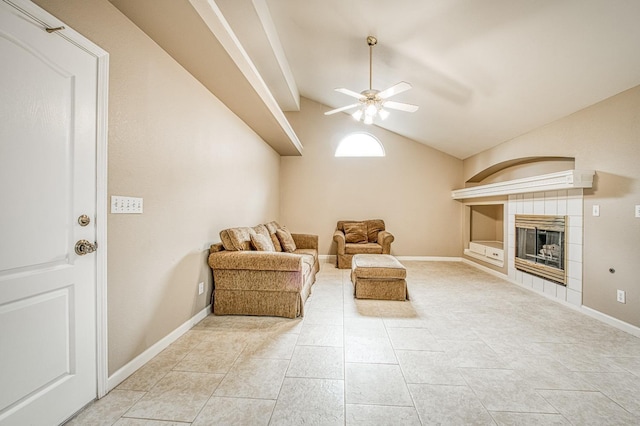 5711 W Fallon Ave, Fresno, CA 93722 - living room with vaulted ceiling, baseboards, a tiled fireplace, built in features, and ceiling fan