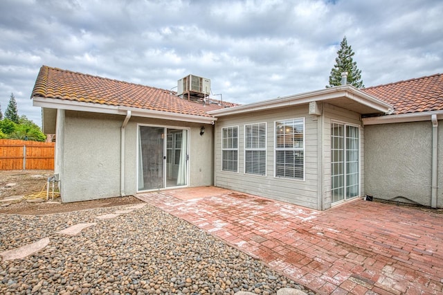 5711 W Fallon Ave, Fresno, CA 93722 - rear view of property with a tile roof, a patio, and stucco siding
