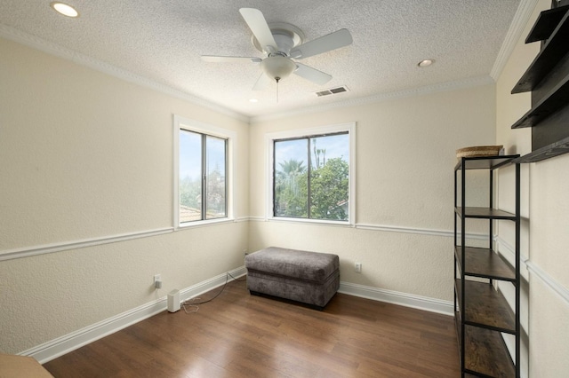 3375 N Berlin Ave, Fresno, CA 93722 - living area with a textured ceiling, wood finished floors, visible vents, and a ceiling fan
