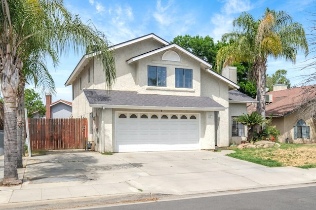 3375 N Berlin Ave, Fresno, CA 93722 - traditional-style home with a chimney, concrete driveway, fence, an attached garage, and stucco siding