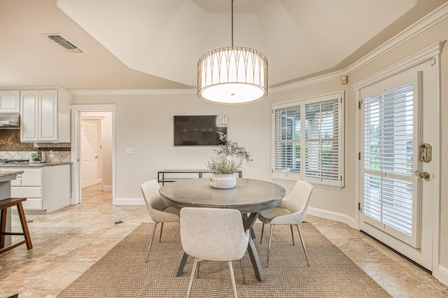 dining space with light tile patterned flooring, vaulted ceiling, visible vents, and baseboards