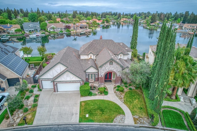 bird's eye view featuring a residential view and a water view