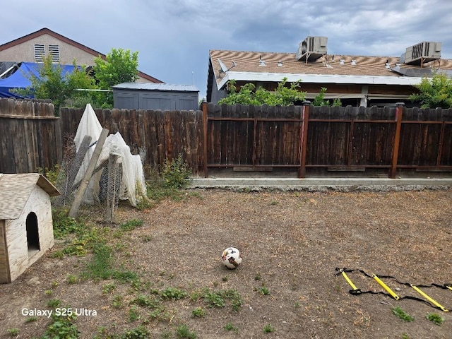 21754 California, San Joaquin, CA 93660 - view of yard with a fenced backyard and central AC unit