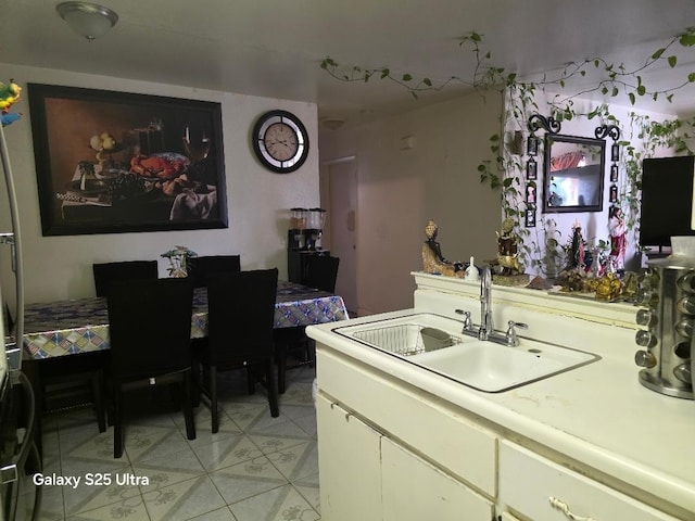 21754 California, San Joaquin, CA 93660 - kitchen with light countertops, white cabinets, and a sink