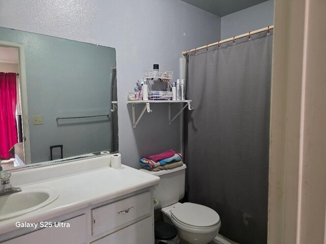 21754 California, San Joaquin, CA 93660 - full bathroom featuring toilet, a shower with shower curtain, and vanity