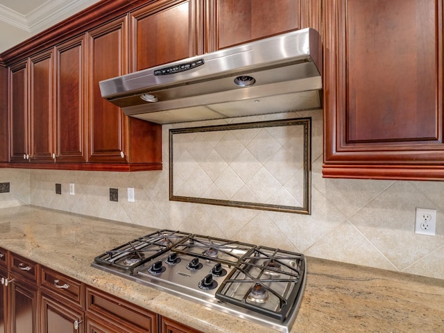 10640 N Old Course Dr, Fresno, CA 93730 - kitchen with stainless steel gas stovetop, backsplash, and under cabinet range hood