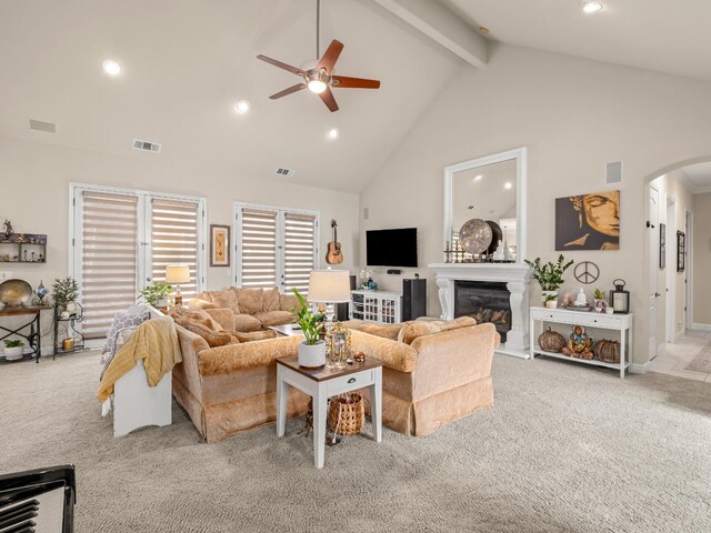 10640 N Old Course Dr, Fresno, CA 93730 - living room with carpet, visible vents, arched walkways, and ceiling fan