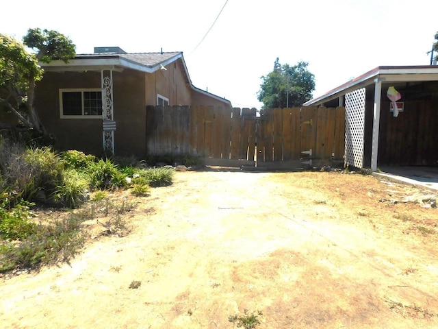 view of home's exterior featuring fence