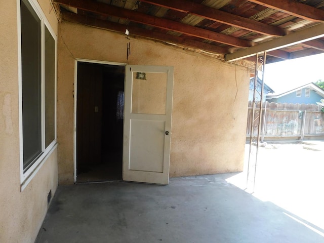 view of patio / terrace featuring fence
