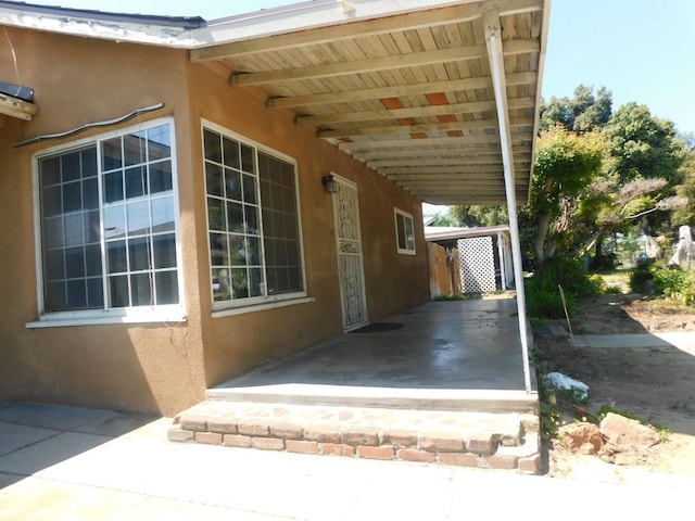 exterior space featuring stucco siding