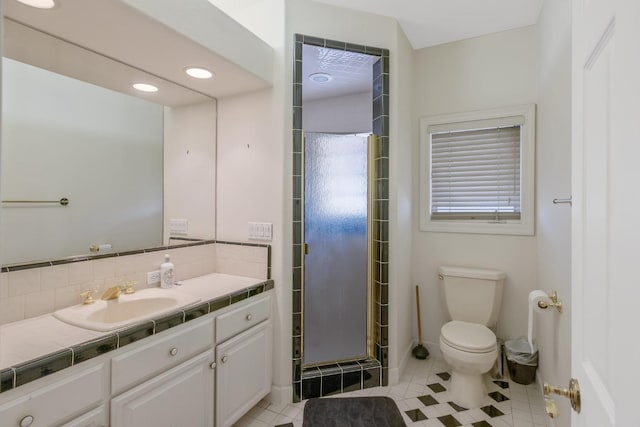 bathroom featuring tile patterned floors, a stall shower, toilet, decorative backsplash, and vanity
