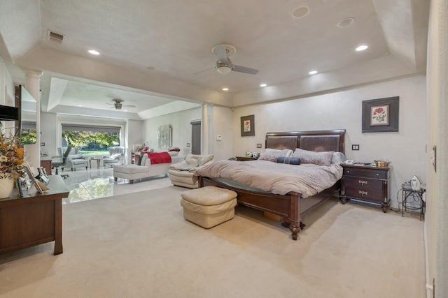 carpeted bedroom with ceiling fan, a raised ceiling, access to exterior, visible vents, and recessed lighting