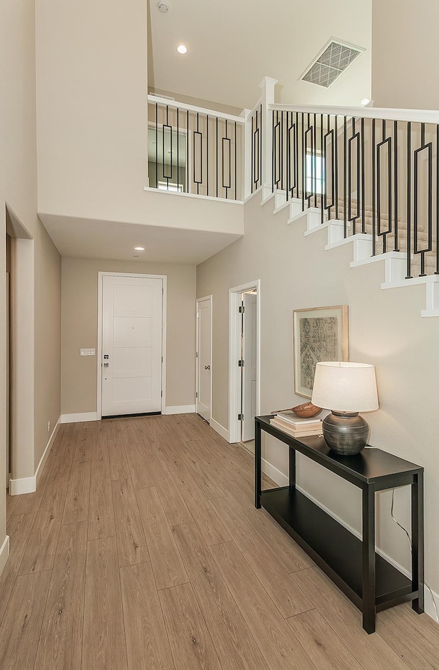 4338 Monarch Pl, Madera, CA 93636 - entrance foyer featuring a towering ceiling, baseboards, wood finished floors, stairway, and recessed lighting