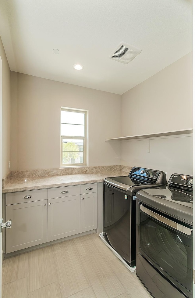 4338 Monarch Pl, Madera, CA 93636 - laundry room featuring washing machine and dryer and cabinet space