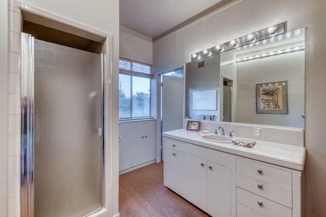 full bath with vanity and a stall shower