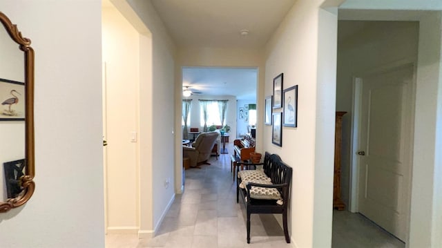 hallway featuring baseboards