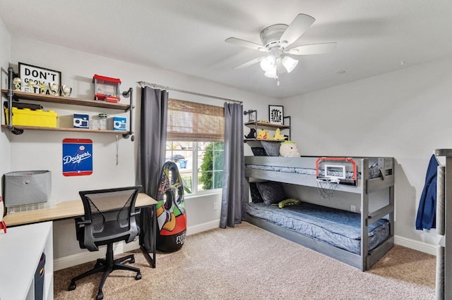 carpeted bedroom featuring ceiling fan and baseboards