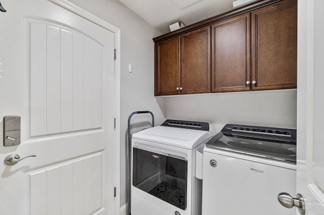 laundry area with cabinet space and washing machine and clothes dryer
