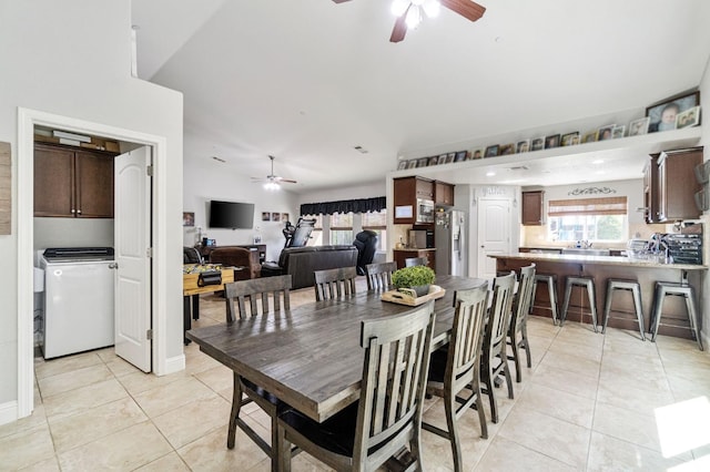 dining area featuring ceiling fan and light tile patterned floors