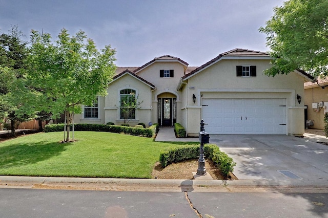 view of front of property with a front yard, a garage, driveway, a tiled roof, and stucco siding