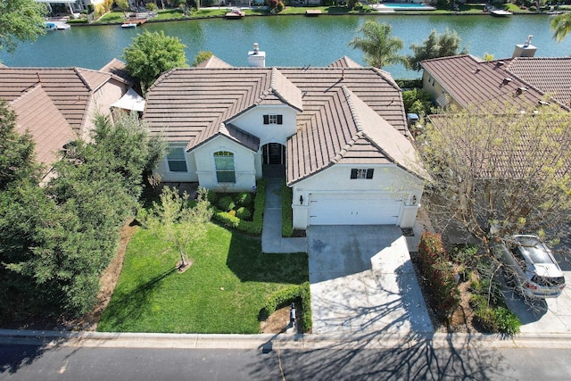 drone / aerial view with a water view