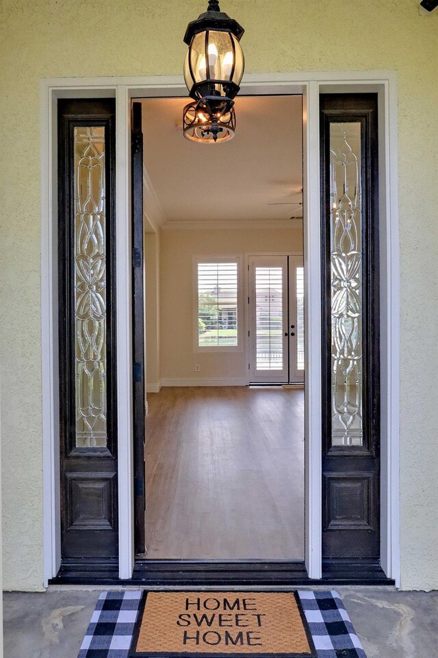 entrance to property with stucco siding